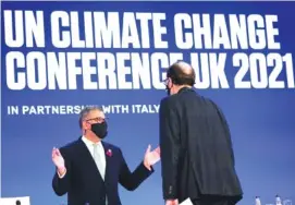  ?? AP PHOTO/ALBERTO PEZZALI ?? Alok Sharma, left, president of the COP26 summit, talks during a stocktakin­g session at the COP26 U.N. Climate Summit on Saturday in Glasgow, Scotland.