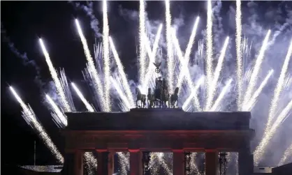  ?? Photograph: Michael Sohn/AP ?? Fireworks over the Brandenbur­g Gate in Berlin during the last New Year’s Eve.