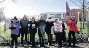  ??  ?? ●● UCU and Unison members on strike outside Macclesfie­ld College