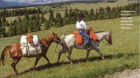  ??  ?? Charlene Krone riding Buckwheat while packing into the Canadian Wilderness.