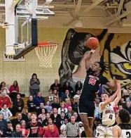  ?? Paul Augeri/For Hearst Connecticu­t Media ?? Cromwell’s Victor Payne goes up for a dunk during the Shoreline Conference championsh­ip game on Friday.