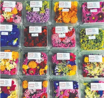  ??  ?? BLOOMING LOVELY: The edible flowers from Julatten Earth Foods are now available at Jonsson's Farm Markets and Cherries Health + Wellness Store.