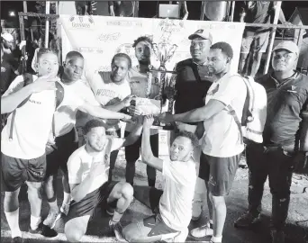  ?? ?? Defending champion Swag Entertainm­ent receiving the championsh­ip trophy and first place package from Sales and Outdoor Manager Sean Grant, after winning their second consecutiv­e Guinness ‘Greatest of the Streets’ Linden edition at the Christians­burg Hardcourt