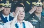  ?? (Reuters) ?? PHILIPPINE PRESIDENT Rodrigo Duterte salutes with military officers during a celebratio­n of the armed forces earlier this month.