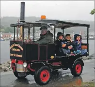  ?? 08_a29tarbboa­t13 ?? Jim Bennett took youngsters on a tour around the marina in his steam-powered engine.