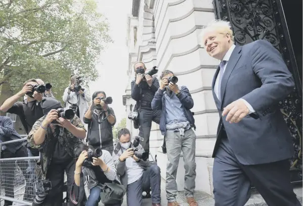  ??  ?? 0 Boris Johnson returns to 10 Downing Street after a Cabinet meeting at the Foreign and Commonweal­th Office yesterday