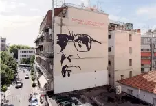  ??  ?? A giant mural depicts Italian composer Ennio Morricone created by Asterios Laskaris, Christos Laskaris and Dimitra Kalogirou under the auspices of the Cultural Society of Friends of Ennio Morricone Music in Larissa.