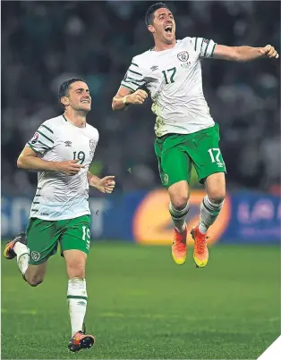  ??  ?? ■
Robbie Brady (left) and Stephen Ward celebrate the 1-0 win over Italy.