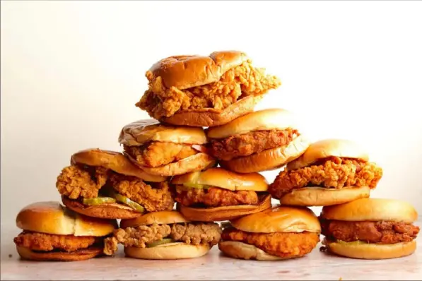  ?? Aaron Hutcherson/Washington Post ?? Fried chicken sandwiches from Chick-fil-A, KFC, McDonald’s, Popeyes and Wendy’s.