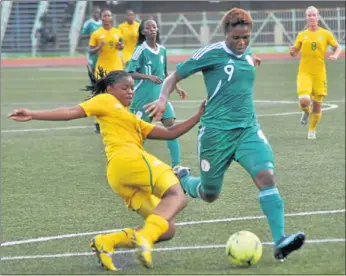  ?? Picture by Gallo Images ?? GOTCHA! Amanze Aigbewi of Nigeria robs Banyna’s Amanda Sister of her booty during an SA-Nigeria internatio­nal friendly in Lagos, Nigeria yesterday.