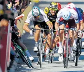  ?? AFP ?? Peter Sagan (2nd left) elbows out Mark Cavendish during the sprint at the end of the fourth stage.