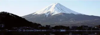  ?? Yomiuri Shimbun file photo ?? Mt. Fiji is seen in Fuji-Kawaguchik­o, Yamanashi Prefecture, in February 2020.