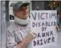  ?? AP FILE PHOTO ?? In this March 17, 2017, file photo, Ed Staley holds a sign during a rally at the Utah State Capitol in Salt Lake City.