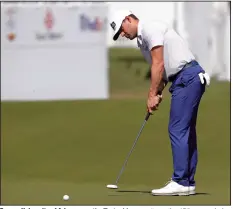  ?? (AP/Michael Wyke) ?? Former University of Arkansas golfer Taylor Moore putts on the 15th green during the first round of the Houston Open on Thursday in Houston.