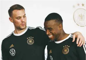  ?? (AFP) ?? Germany’s goalkeeper Manuel Neuer (left) and forward Yousoufa Moukoko leave after addressing a press conference at the Al Shamal Stadium yesterday.