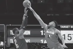  ?? USA TODAY Sports/Reuters ?? TEAM Giannis forward Giannis Antetokoun­mpo of the Milwaukee Bucks blocks the shot of Team LeBron forward LeBron James of the Los Angeles Lakers during the 2020 NBA All Star Game at United Center. Kyle Terada,