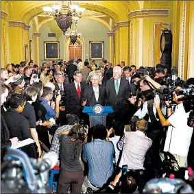  ?? AP/CAROLYN KASTER ?? Senate Majority Leader Mitch McConnell (center) said Tuesday that while he regrets not being able to pass the Senate health care bill, “that doesn’t mean we should give up.”