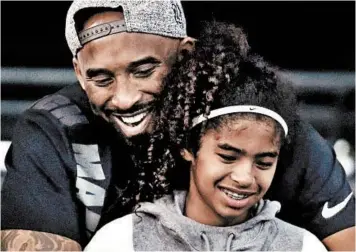  ?? CHRIS CARLSON/AP ?? Kobe Bryant pictured with daughter Gianna. They died in a helicopter crash Jan. 27.