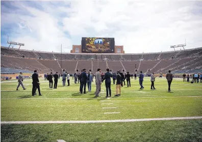  ?? RAFA AMAYA/UNIVERSITY OF NEW MEXICO ATHLETICS ?? Well-dressed University of New Mexico football players walk through Notre Dame Stadium on Friday. The place will be packed Saturday as the Lobos face the No. 7 Fighting Irish in a game airing on NBC.