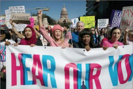  ?? RALPH BARRERA/AUSTIN AMERICAN-STATESMAN VIA AP ?? In this Saturday, Jan. 21, 2017 file photo, former Texas State Sen. Wendy Davis, center, dressed in all pink, leads the Women’s March in Austin, Texas.