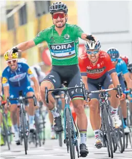  ?? Picture: Christophe Ena ?? Peter Sagan crosses the finish line ahead of Italy’s Sonny Colbrelli, second right, and Belgium’s Philippe Gilbert, second left, in Quimper yesterday.