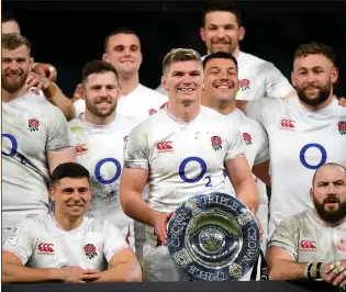  ??  ?? WINNERS: The England rugby team with this year’s Triple Crown Trophy