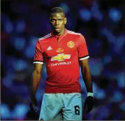  ?? LAURENCE GRIFFITHS / GETTY IMAGES ?? Manchester United’s Paul Pogba played for a small French amateur club that got $330,000 when United paid a transfer fee to Juventus.