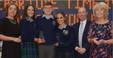  ??  ?? Sixth year head Margaret McCormack with Aoife Cullinan, Brian Short and Molly Hayes who received their Gradam Speisialta from principal Shane Eivers and deputy principal Carol Buckley.