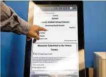  ??  ?? The new voting machine system, manufactur­ed by Denver-based Dominion Voting Systems, is scheduled to be rolled out statewide in time for the March 24 presidenti­al primary.