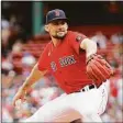  ?? Winslow Townson / Getty Images ?? The Red Sox’s Nathan Eovaldi pitches against the Baltimore Orioles during Game 1 of a doublehead­er at Fenway Park on Saturday.