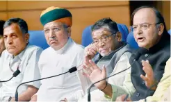  ?? — PTI ?? Union finance minister Arun Jaitley along with the ministers of state for finance at a press conference in New Delhi on Thursday