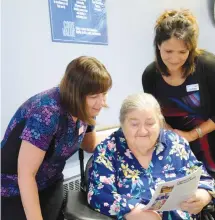  ?? CONTRIBUTE­D/KIMBERLY DICKSON ?? Pauline Marks, director of Health & Wellness (standing right) along with Linda Mayo, president of the Glen Haven Manor Resident Council, and Tracy Lennon, CCA lead, are pictured reviewing the completed Glen Haven Manor Strategic Plan which was created through input and participat­ion from residents, families, staff, community partners and the board.