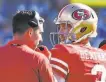  ?? Jayne Kamin-Oncea / Getty Images 2018 ?? Coach Kyle Shanahan and quarterbac­k C.J. Beathard confer during a 2018 game.
