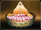  ??  ?? Roma Centerpiec­e Amber glass bowl AED 2,425