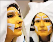  ?? CHRIS SWEDA/CHICAGO TRIBUNE ?? Sandra Harrison, left, of Orlando, Fla., and Camilla McGugan, of London, both dressed as Ahsoka Tano.