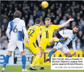  ?? PICTURE: EPIC ACTION IMAGERY ?? Ben Turner wins a header in Burton Albion’s League One game against Bristol Rovers.