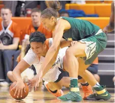  ?? BRODY SCHMIDT/ASSOCIATED PRESS ?? Oklahoma State’s Kaylee Jensen, bottom, and Baylor’s Alexis Prince scramble for the basketball.