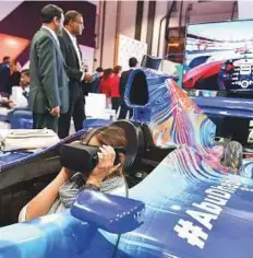  ?? Ahmed Ramzan/ Gulf News ?? Visitors experience Virtual Reality at Yas Island pavilion