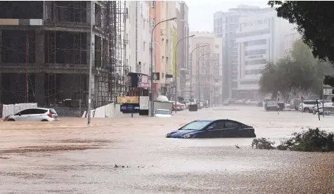  ?? Reuters ?? Cars are seen abandoned on a flooded street in Muscat after Cyclone Shaheen made landfall yesterday.