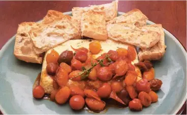  ?? PHOTO BY ANNE BRALY ?? Candy your cherry tomatoes and serve them over baked cheese to make the most of cherry tomato season.