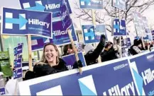  ?? John Minchillo/Associated Press ?? Supporters of Democratic presidenti­al candidate Hillary Clinton cheer Friday before the McIntyreSh­aheen 100 Club Celebratio­n in Manchester, N.H.