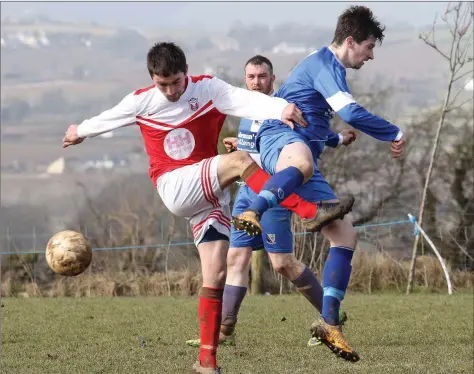  ??  ?? Pa O’Shea of Moyne Rangers and Kevin Coleman of Tombrack United get in a tangle during their recent Premier Division game in Ballyboy.