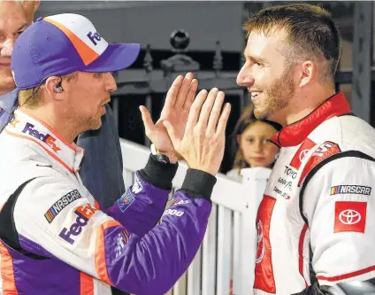  ?? Brian Lawdermilk / Getty Images ?? Denny Hamlin, left, tries to console Matt DiBenedett­o after Saturday’s Monster Energy Cup race at Bristol, Tenn. Hamlin passed DiBenedett­o late to win. DiBenedett­o, who is losing his ride with his race team, finished second after leading a race-high 93 laps.