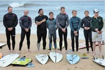  ?? Picture: MARK CARRELS ?? SAD TRIBUTE: Surfers listen to speeches on the shore at Kelly’s Beach on Friday October 27 before a paddle out to sea in tribute to body surfer Graeme ‘Sunny’ Hill.