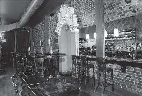  ?? PHOTOS: MARIE-FRANCE COALLIER/ THE GAZETTE ?? Le Bureau Bar Tapas on Notre Dame St. W. is a welcome sight on a winter evening: gleaming varnished tables, gorgeous lighting and studded leather benches.