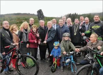  ??  ?? Minister Ring turns the sod on the new Coolaney Mountain Bike Trail. Pics: Donal Hackett.