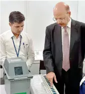  ??  ?? Chief Election commission­er Nasim Zaidi demonstrat­es the working of EVMs and Voter Verifiable Paper Audits Trail System in New Delhi on Saturday. — PTI