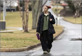  ?? KATHY KMONICEK — THE ASSOCIATED PRESS ?? Kailani Taylor-cribb walks through her neighborho­od in Asheville, N.C., on Tuesday, Jan. 31, 2023. Kailani hasn’t taken a single class in what used to be her high school since the height of the coronaviru­s pandemic. She vanished from the public school roll in Cambridge, Mass., in 2021 and has been, from an administra­tive standpoint, unaccounte­d for since then.