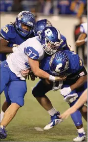  ??  ?? Bryant Hornets senior linebacker Jakob Neel tackles a North Little Rock’s Brandon Thomas during the Class 7A state-championsh­ip game Dec. 1. Neel finished with a team-high 10 tackles in the Hornets’ win over the Wildcats.