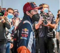  ?? — AFP ?? Eager for action: Marc Marquez arrives to give a press conference at the Algarve Internatio­nal Circuit in Portimao.